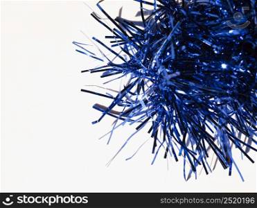 Blue tinsel used as a Christmas decoration. Blue Christmas tinsel