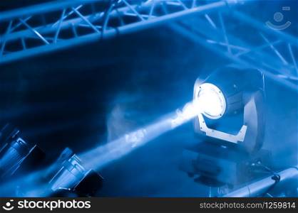 blue toned spotlight on a theatre stage lighting rig
