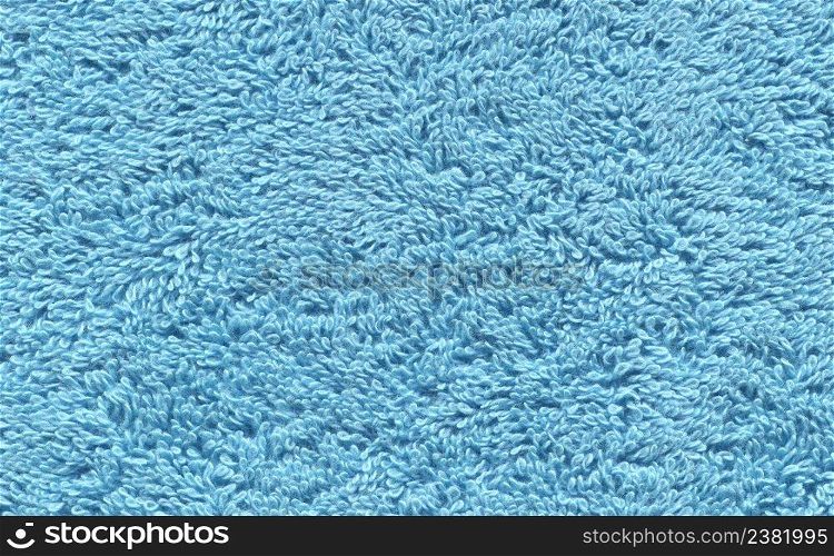 Blue towel texture. Blue towel background. Blue soft cotton textile surface towel