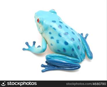 blue toy frog on white background