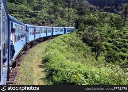 Blue train on the railroad in Sri Lanka