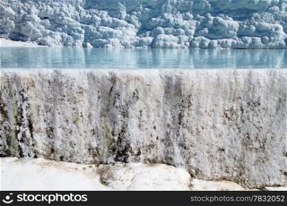 Blue travertine formations and water in Pamukkale, Turkey