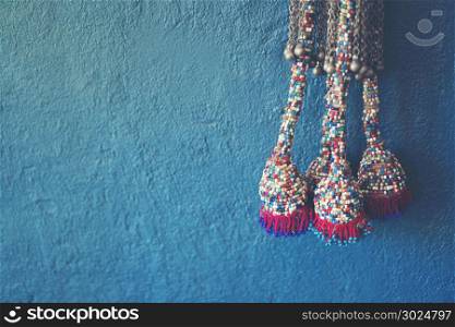 Blue wall background with knitting yarn