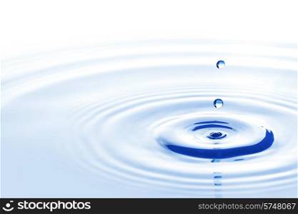 Blue water drops falling down close up. Water drop falling down