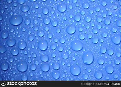 blue water drops on glass