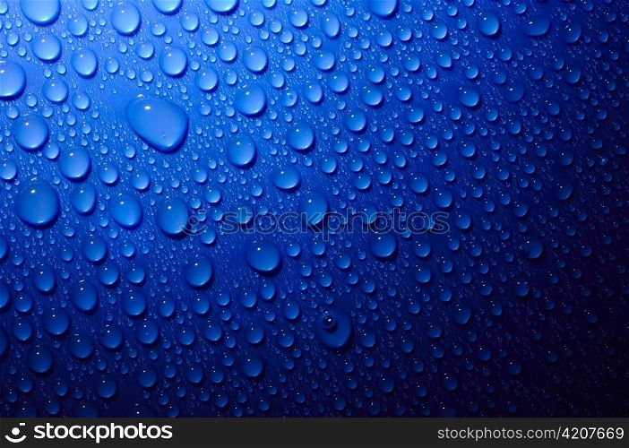 blue water drops on glass