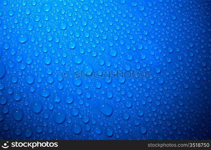 blue water drops on glass, top view