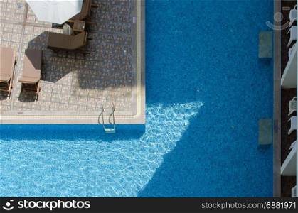 Blue water in a hotels swimming pool.Top view