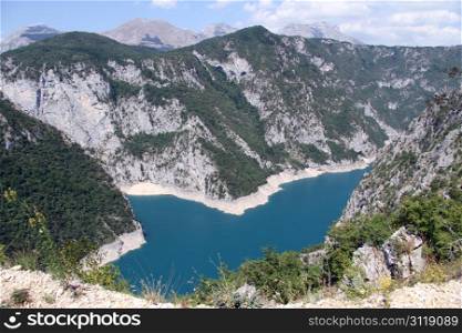 Blue water of Piva lake in Montenegro