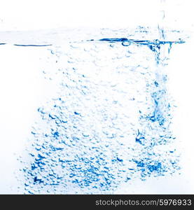 Blue water splash close up on a white background. Water splash