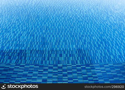 Blue water texture in swimming pool. Travel and summer background concept.