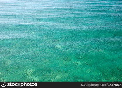 Blue water with sun reflections