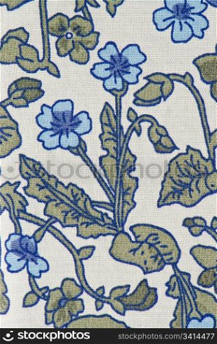 Blue, white and green textile pattern with floral ornament useful as background