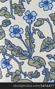 Blue, white and green textile pattern with floral ornament useful as background
