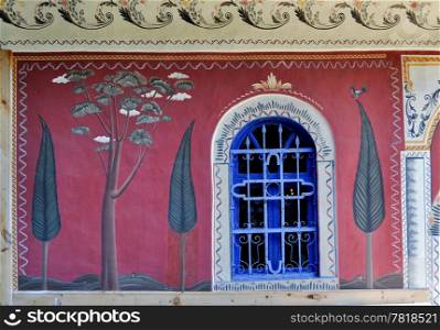 Blue window and fresco on the wall of christian orthodox monastery