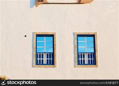 blue window in morocco africa old construction and brown wall construction