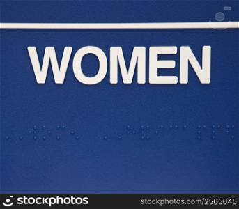 Blue women sign with braille.