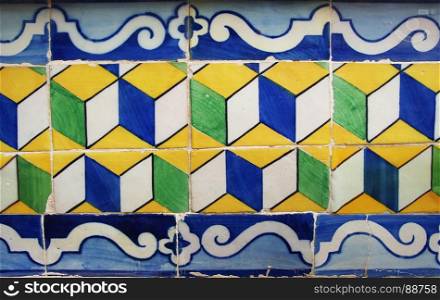 Blue, yellow and green Portuguese tiles (azulejos) with geometric pattern