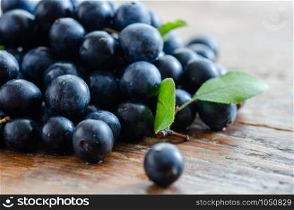 Blueberries antioxidant organic superfood on wooden table for healthy eating and nutrition