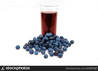 Blueberries are a good source of antioxidants. a clear glass with berry juice with berries all around on a white background.. Blueberries And Blueberry Juice