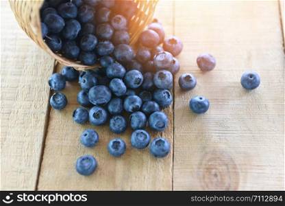 blueberries basket in a wooden table background / fresh blueberry tasty fruit