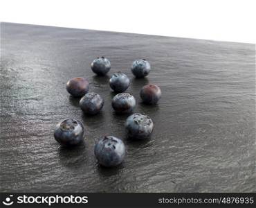 Blueberries on a slate and white Backround&#xA;