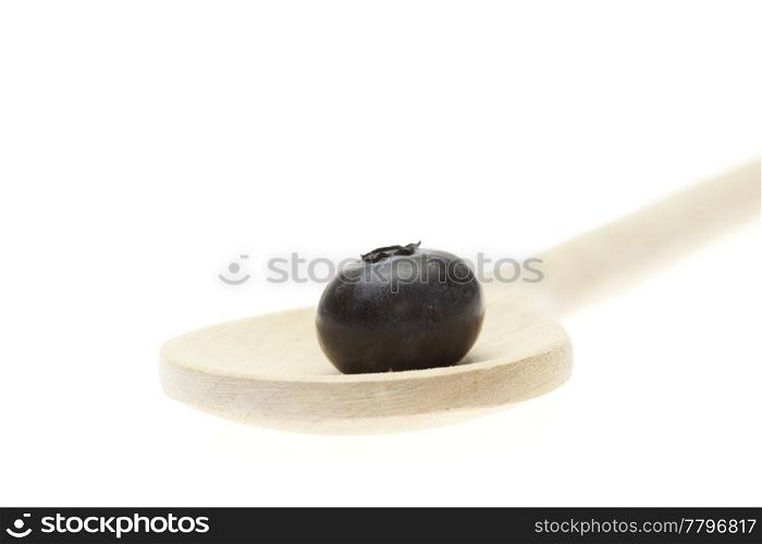 blueberries on the spoon isolated on white