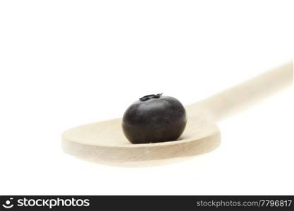 blueberries on the spoon isolated on white