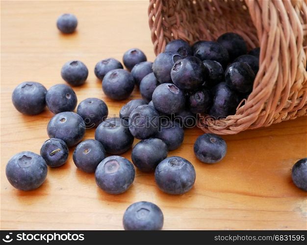 Blueberry antioxidant organic superfood on wooden table. Concept for healthy eating and nutrition