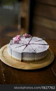 Blueberry cheesecake on wooden table . Blueberry cheesecake