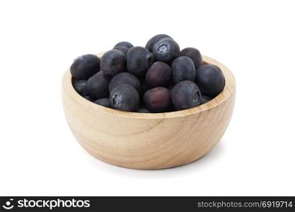 blueberry in wooden bowl isolated on white background with clipping path and soft shadow