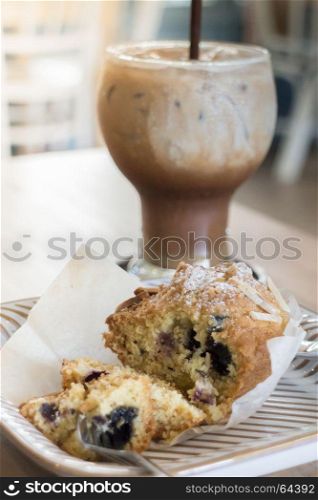 Blueberry muffin and iced coffee mocha, stock photo