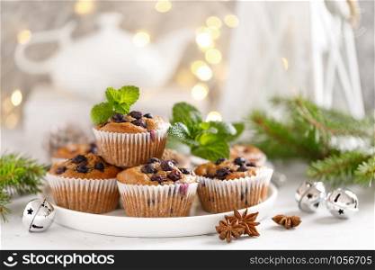 Blueberry muffins with fresh berries and Christmas, Xmas or New Year decorations