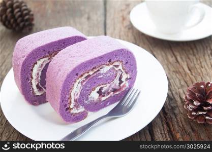 Blueberry roll cake on white plate, Lifestyle concept, Unhealthy