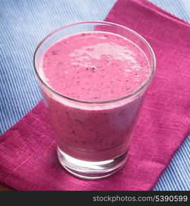 blueberry smoothie in a glass on the table