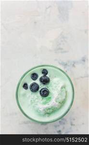 Blueberry smoothie on a white. Blueberry smoothie on a white concrete background