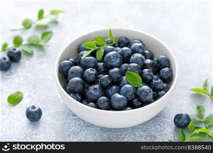 Blueberry with leaves in a bowl