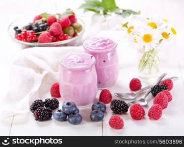 blueberry yogurt with fresh berries on wooden table