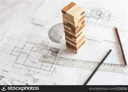 blueprint wooden block tower, Planning, risk and strategy in business or architectural project