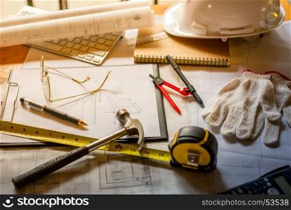 Blueprints, Hardhat, Glasses, Stickers, Construction level, Pen in architecture office retro style.