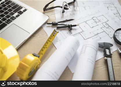 blueprints tools near laptop