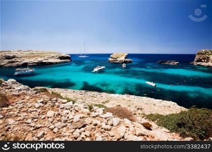 Blug lagoon on a warm summer day on Comino Island, Malta