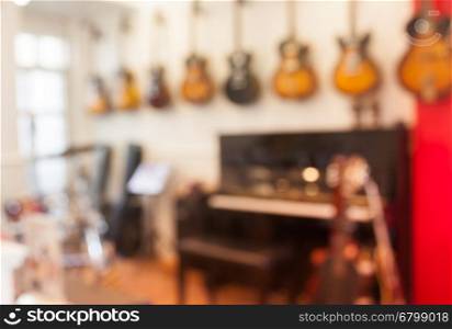 Blur abstract background with instrumentsin music store, stock photo