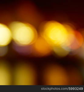 Blur abstract orange holiday lights can be used for background