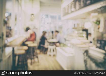 blur background interior of coffee shop with vintage style effect