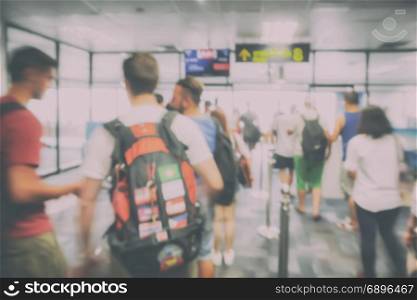 Blur background travelers boarding area at airport