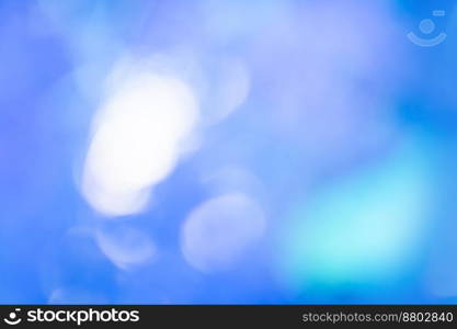 Blur blue air space and bright soft light. Blurry blue sky and sunset abstract defocused bokeh lights.. White sun rays effect with transparency blurred bokeh out of focus background