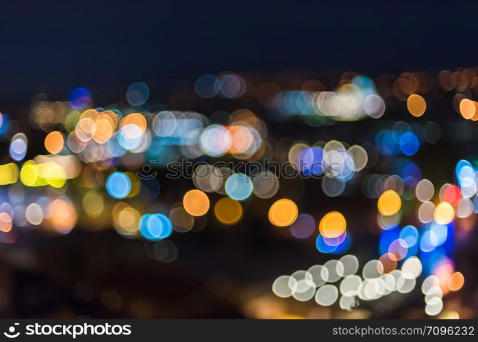 Blur blue night view of city lights with bright circle shape bokeh