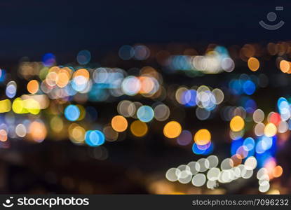 Blur blue night view of city lights with bright circle shape bokeh