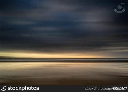 Blur effect on landscpae image to create artistic impression of beach landscape